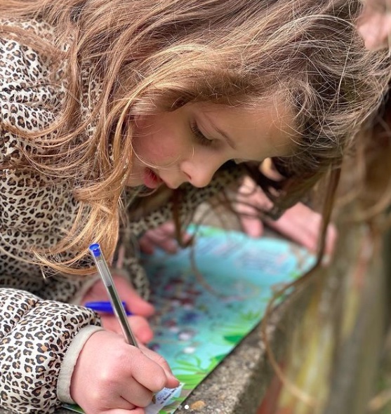 Girl completing treasure map
