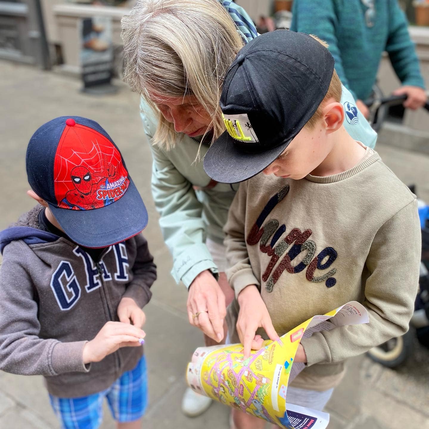 Grandparent and children reading treasure map