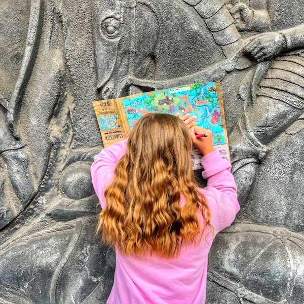 Girl reading treasure map