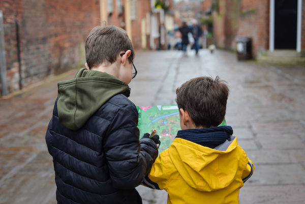 Two boys reading a Treasure Map Trail